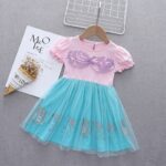 stage for kids A Kids Summer Short Sleeve Mermaid Dress with a bow on it.